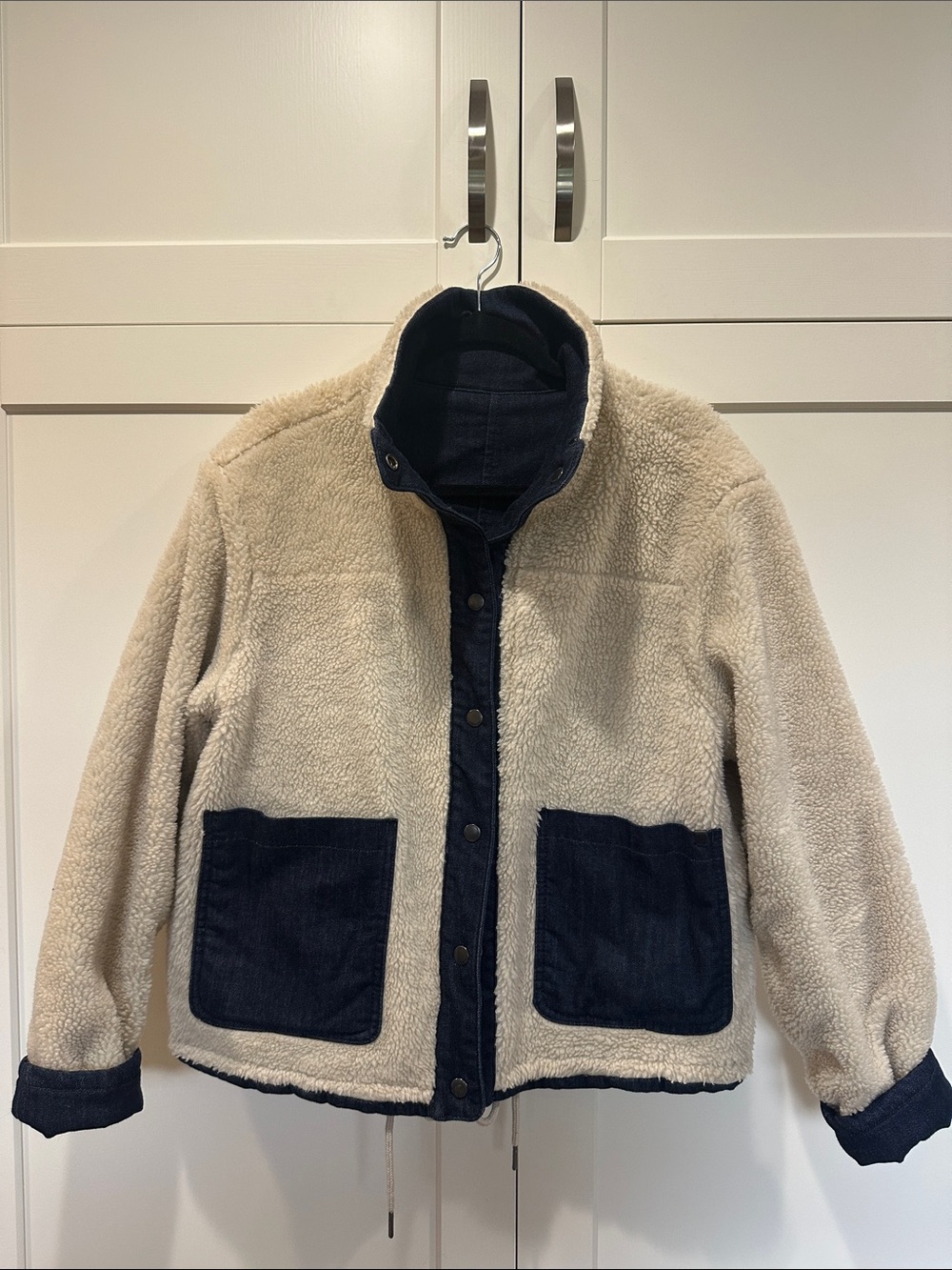 Woman’s reversible Cream Sherpa Jacket with denim Navy Trim